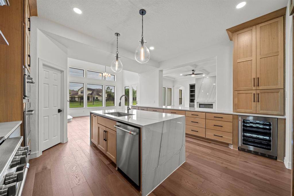 The kitchen allows a view of all of the living areas downstairs