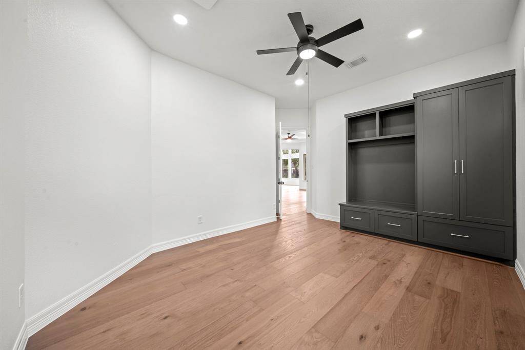 With a built in closet and storage space it could be another bedroom downstairs or a second study or kids play room.
