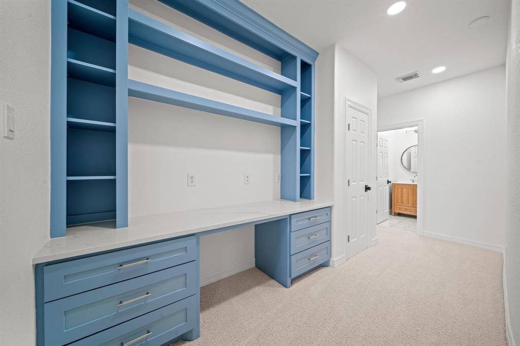 The built in desk is off the gameroom with pleny of space for homework or project work