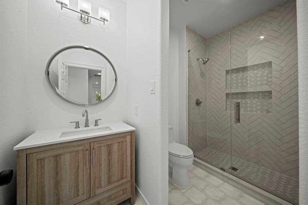 Secondary bathrooms upstairs are elegant and tasteful
