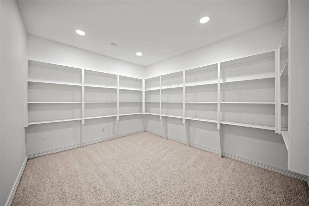 This large storage room is off the media room and can be used for storage or as an additonal playspace
