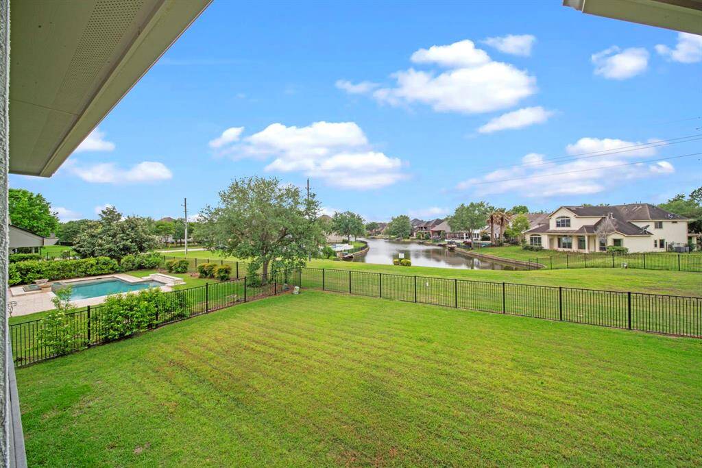 The backyard provides access to the park next door and the greenspace and water at the back