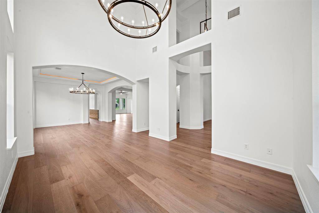 The formal living room space connects to the open formal dining room