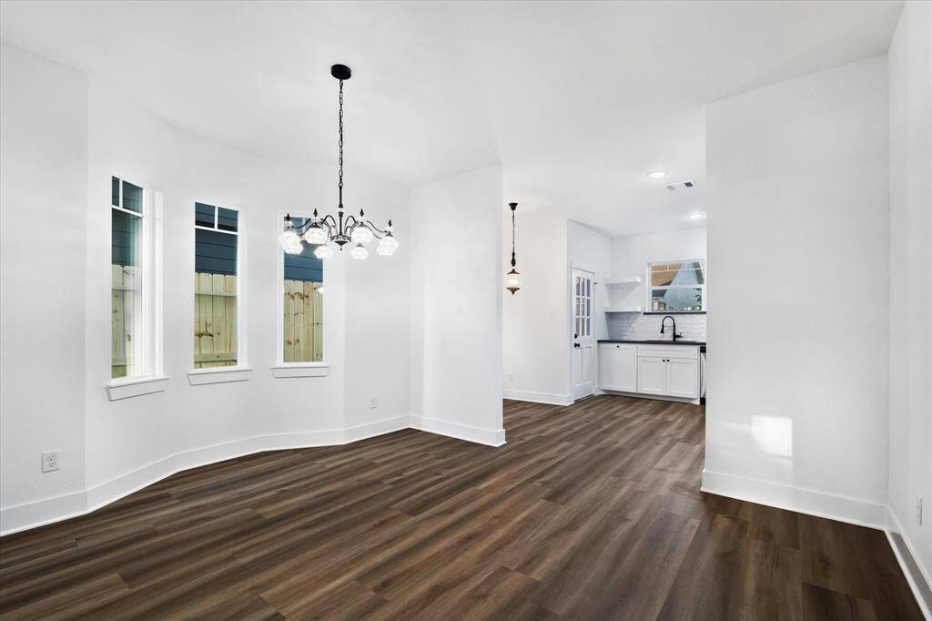 Welcome to 231 S Broadway Street! The kitchen offers tons of lovely features! Like a pull-out cabinet for the trash can, exposed shelves for your decor, a large undermount sink and all pictured appliances are INCLUDED