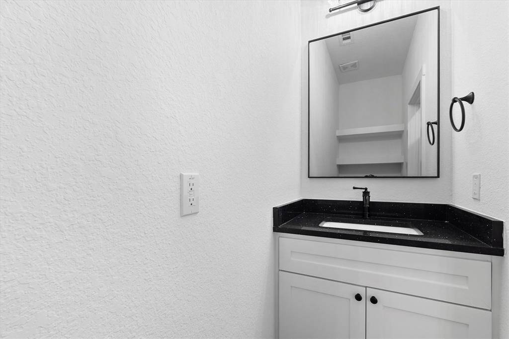 Next, you'll find the half bathroom on the first floor. No guests have to go upstairs!