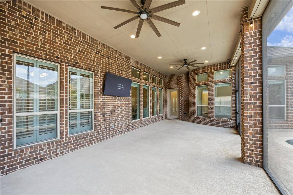 Covered patio with ceiling fans.