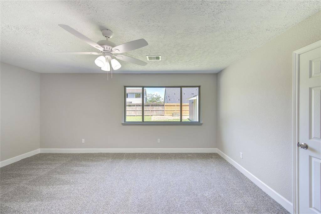 Another view of the primary suite - door leads to primary bath.