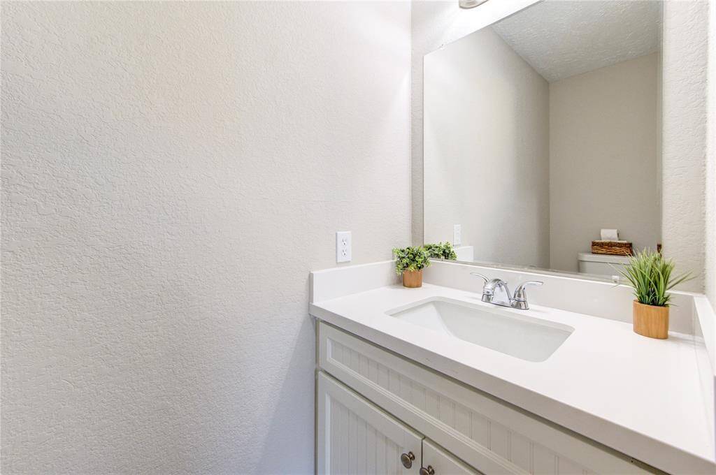 A lovely half bath conveniently located adjacent to the living room.