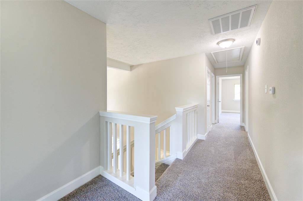 Here is a view of the second story hallway.  One thing you won't feel is cramped.  Plenty of space between bedrooms!