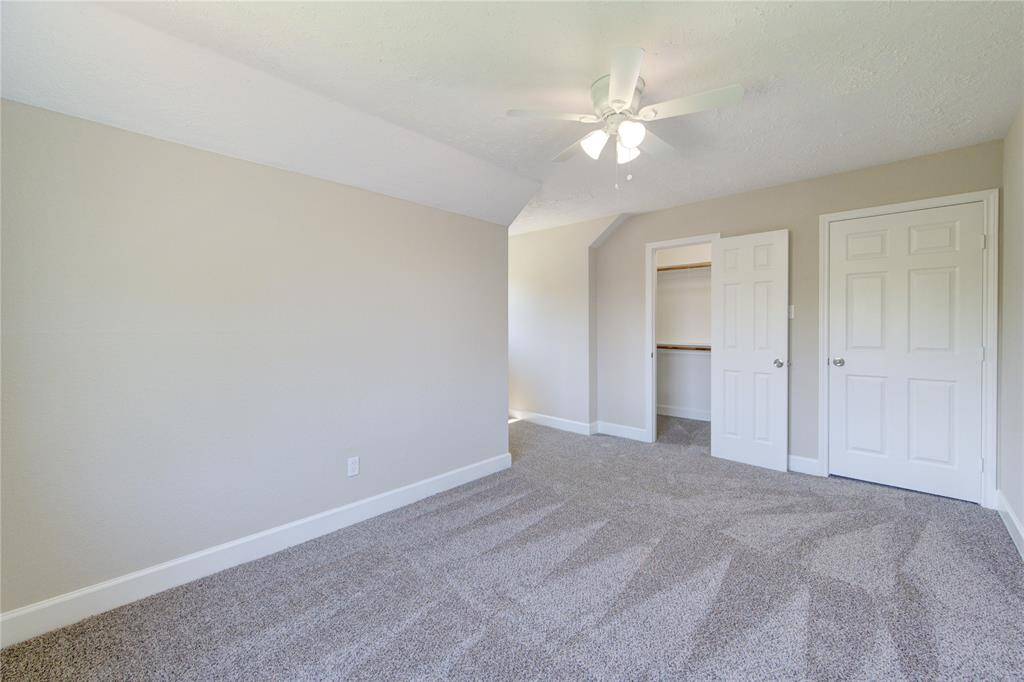 Secondary bedrooms offer carpet, high ceilings and all come with custom build closets. This is bedroom 2.