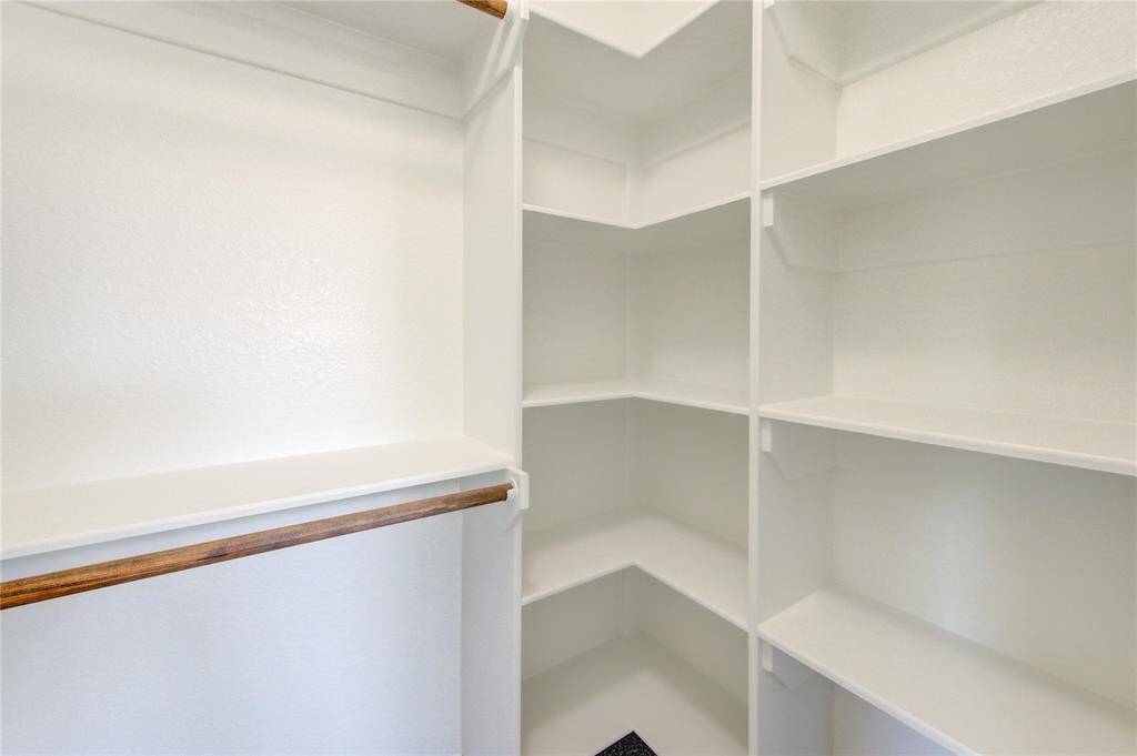 Custom built-in shelving in all bedroom closets.