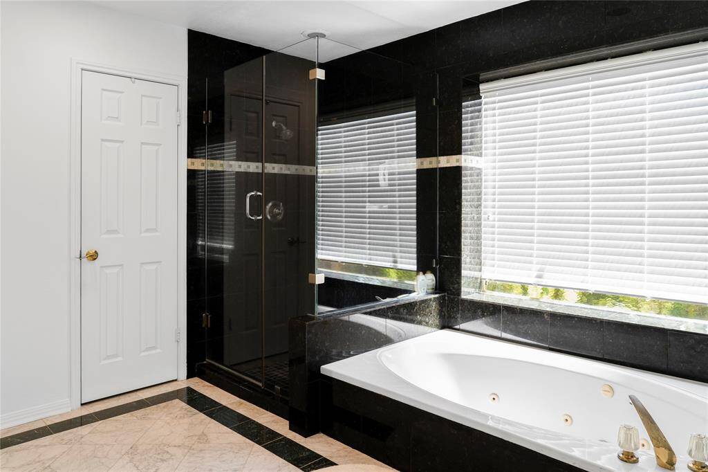 Master bath features large soaking tub and walk in shower!