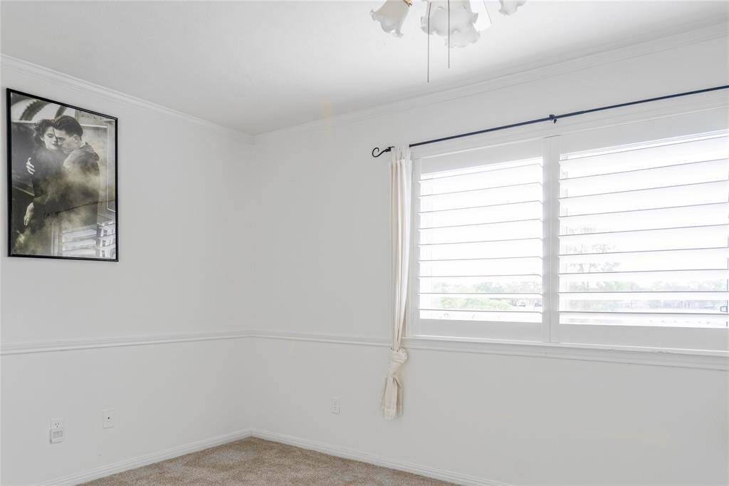 Third bedroom with planting shutters.