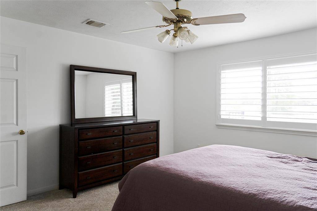 This second bedroom offers a breathtaking view of the golf course!