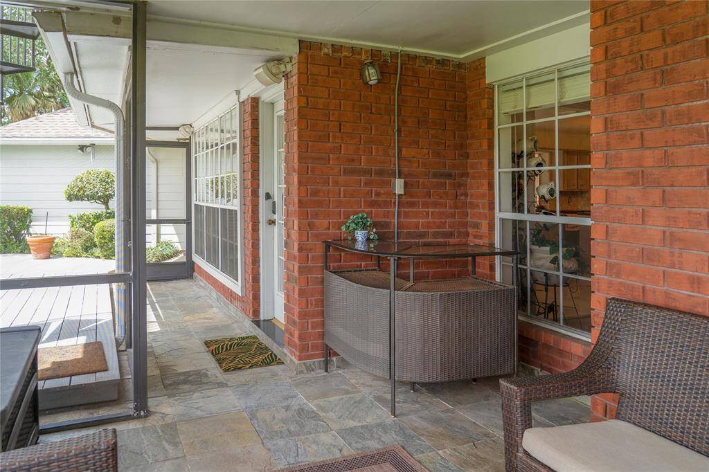 The screen porch is perfect for the hot summers. It’s a great place to relax and entertain!