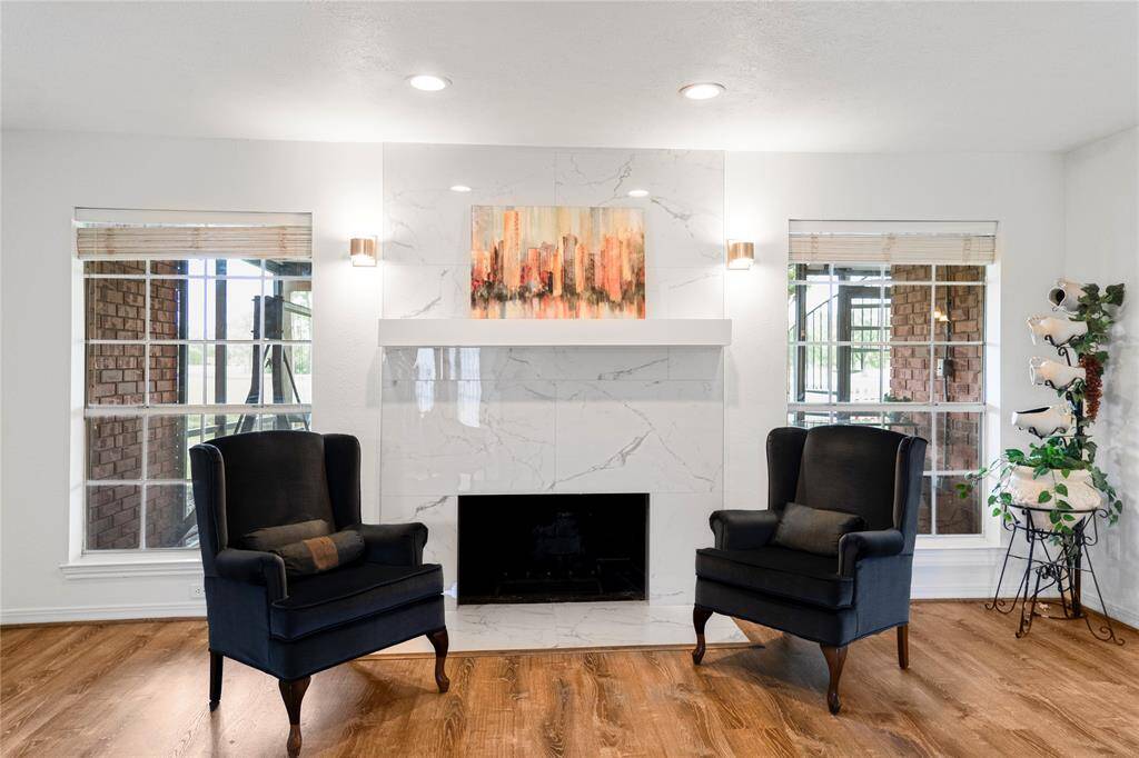 The newly updated fireplace offers a warm, inviting space to relax and escape into a favorite read.