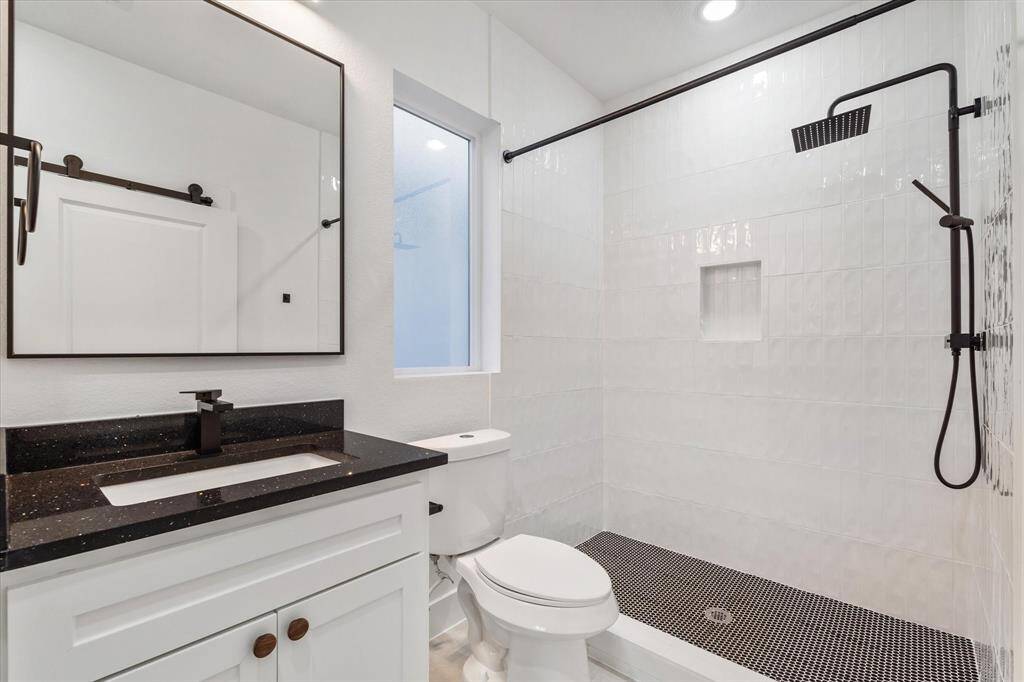 The primary bedroom has everything you need—luxury vinyl flooring, a ceiling fan to keep things cool, recessed lighting, and your own en suite bathroom for that extra touch of privacy.