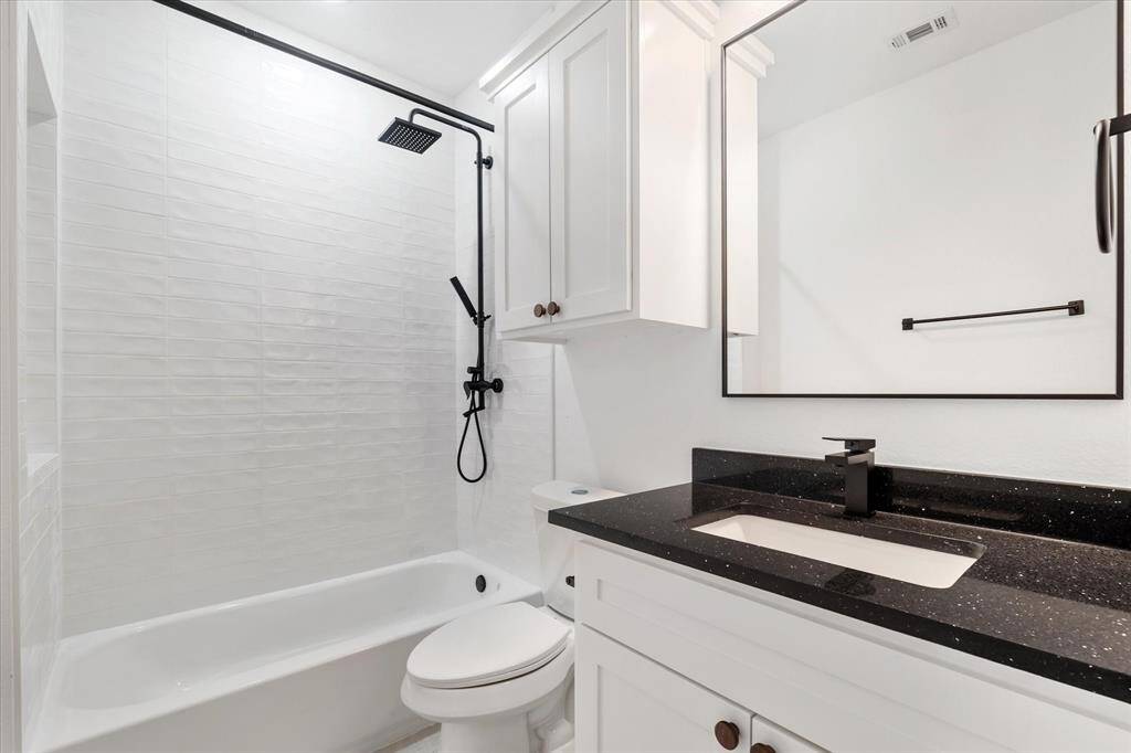 The laundry room is upstairs and comes fully equipped with storage and hanging space.