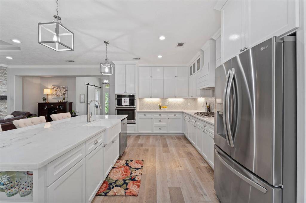 Look at the storage in this kitchen!  Cabinets go all the way to the ceiling, perfect to store those rarely used items.