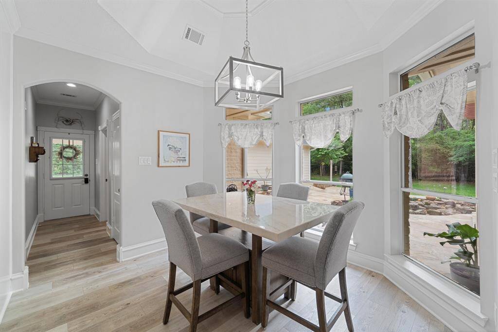 Beyond the breakfast room is the laundry room and outdoor access.