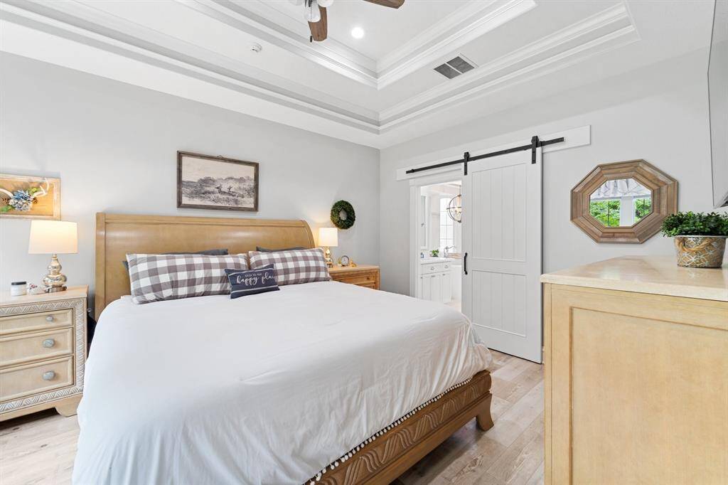 On the opposite side of the family room is the Primary Bedroom and bathroom.