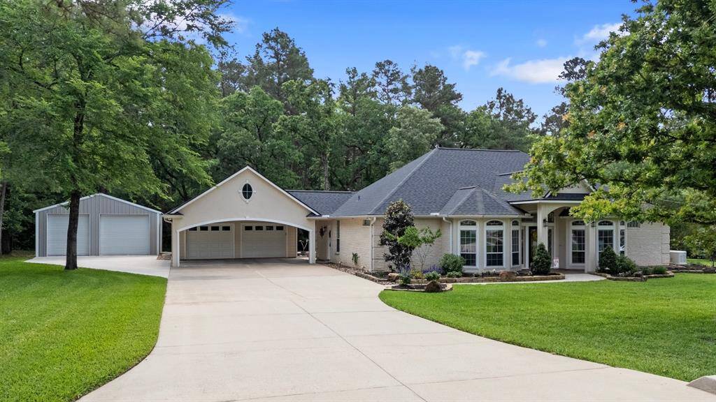 This home features 3 beds, 3 baths, 2 car garage with porte cochere, and a workshop on just less than an acre.