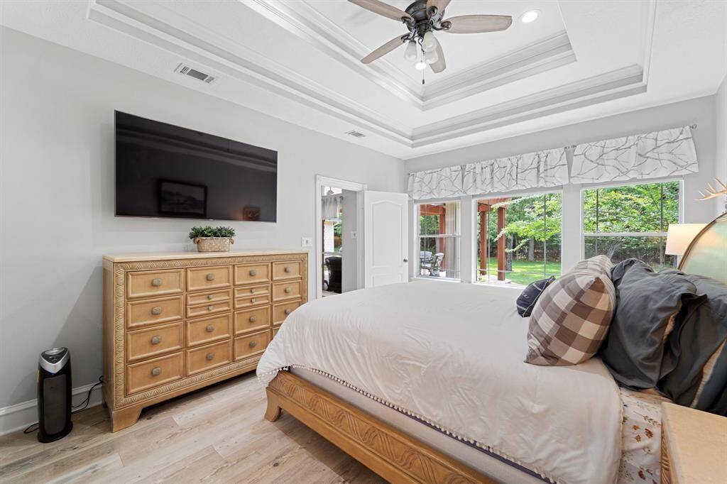 Primary sits off the back of the home with three large windows so you can enjoy the backyard scenery.