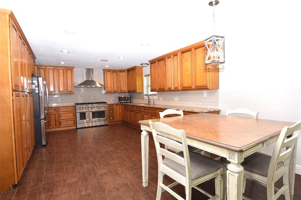 A cozy eat-in dining area adds charm and functionality, creating the perfect spot for casual meals or morning coffee.