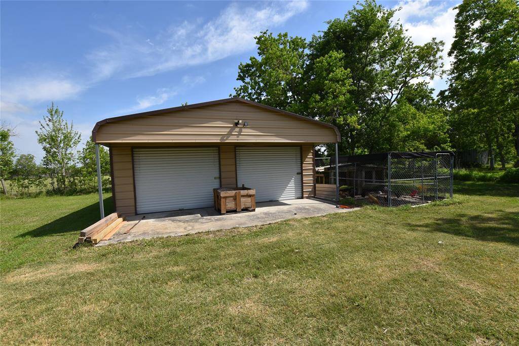 A large workshop provides ample room for projects, hobbies, or storage.