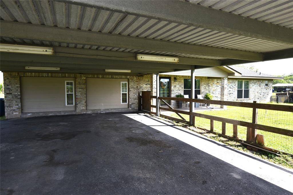 This property features an extra-long covered parking area, providing ample space for multiple vehicles.