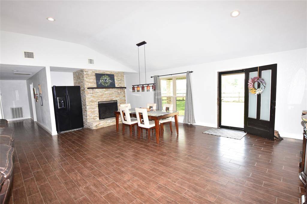 The elegant fireplace in the formal dining area adds warmth and charm.