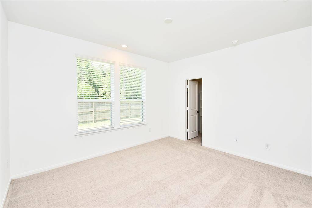 The two additional secondary bedrooms are conveniently located together, offering easy access to the guest bathroom