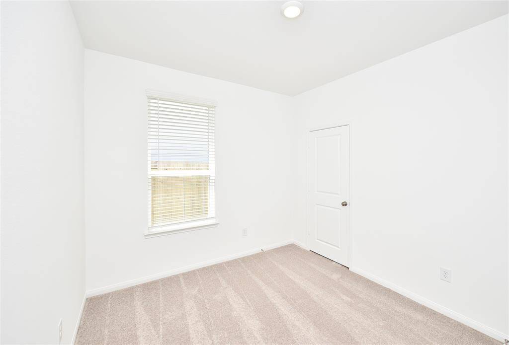 A look at the fourth bedroom. All bedroom s have brand new carpet and blinds.