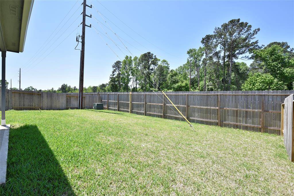 Enjoy the inviting backyard, complete with a covered deck perfect for relaxing outdoors. With plenty of space, it’s ideal for playtime, entertaining, or simply unwinding.