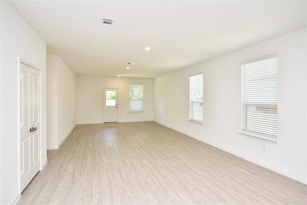 This home features a spacious family room, perfect for relaxing and enjoying meaningful moments with family and friends. The open layout offers plenty of space to gather, making it an inviting spot for everyday living
