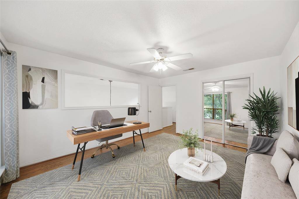 Virtually Staged to show potential home office setup for this extra bedroom!