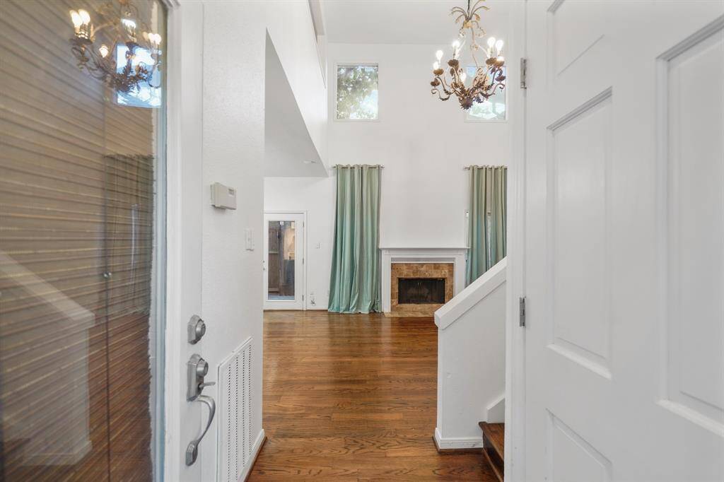 Step inside and fall in love! Soaring ceilings, elegant fixtures, gleaming hardwoods and fresh paint welcome you home!