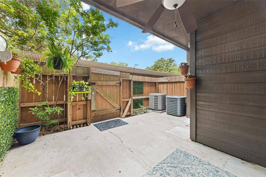 The inviting covered patio features sliding glass doors that seamlessly connect to the indoor space, creating a perfect flow between inside and out.