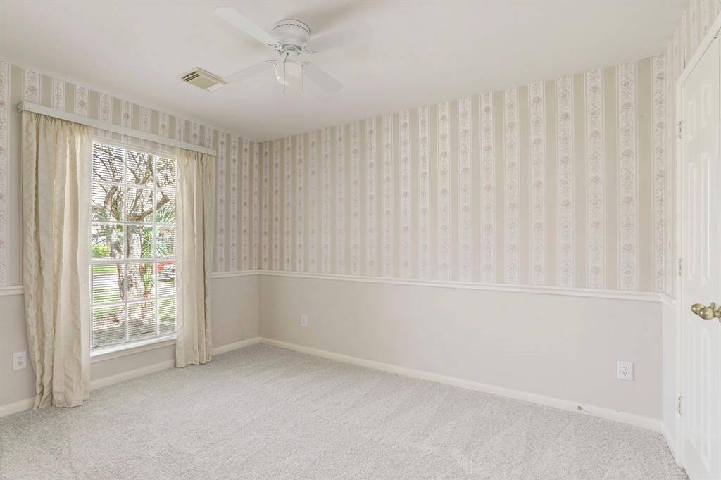 SECOND BEDROOM WITH FRESH CARPET.