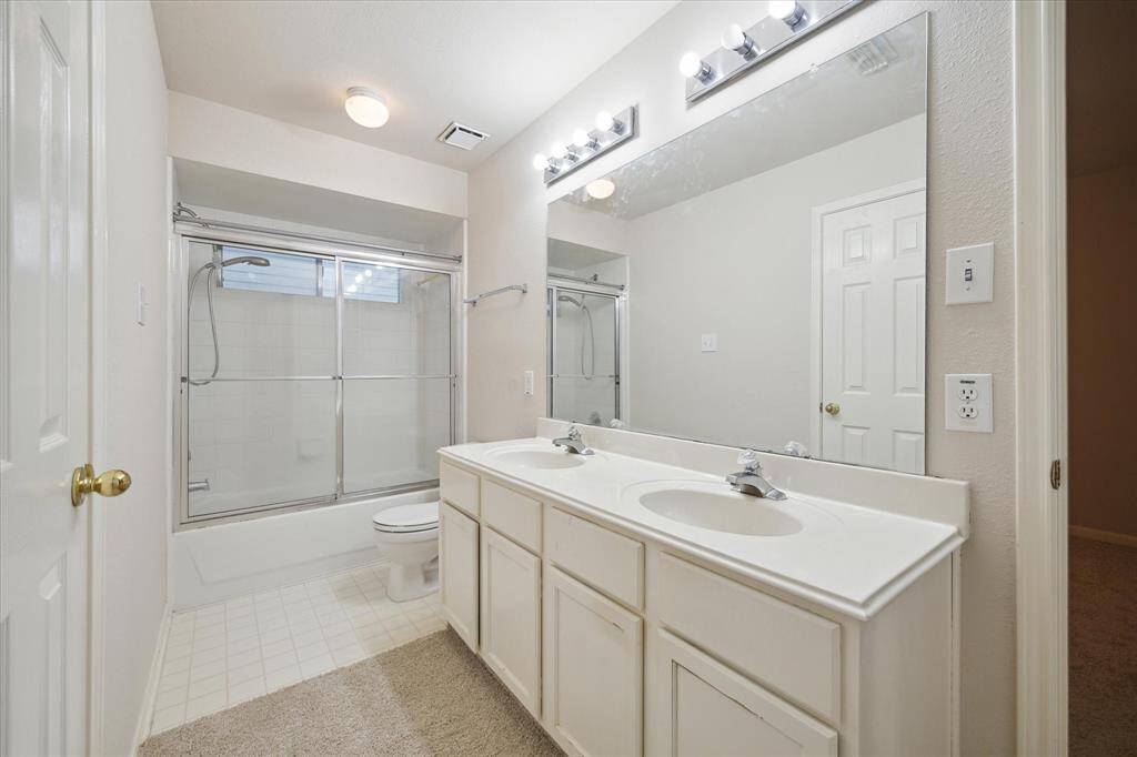THE 2ND AND 3RD BEDROOMS SHARE THE FULL BATH WITH DOUBLE SINKS AND A TUB/SHOWER COMBINATION.