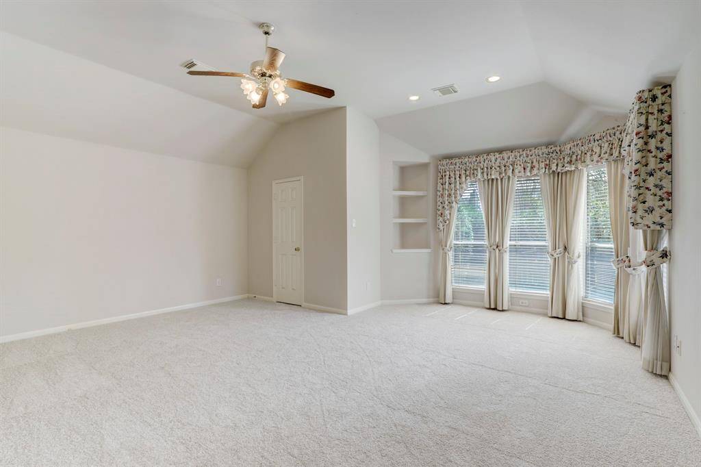 SPACIOUS PRIMARY SUITE WITH FRESH CARPET.