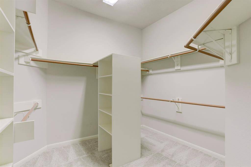 PRIMARY WALK-IN CLOSET.