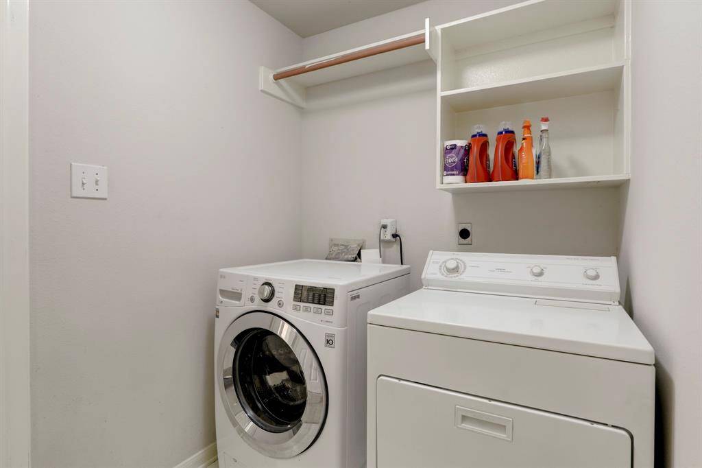 UTILITY ROOM WITH WASHER AND DRYER INCLUDED.
