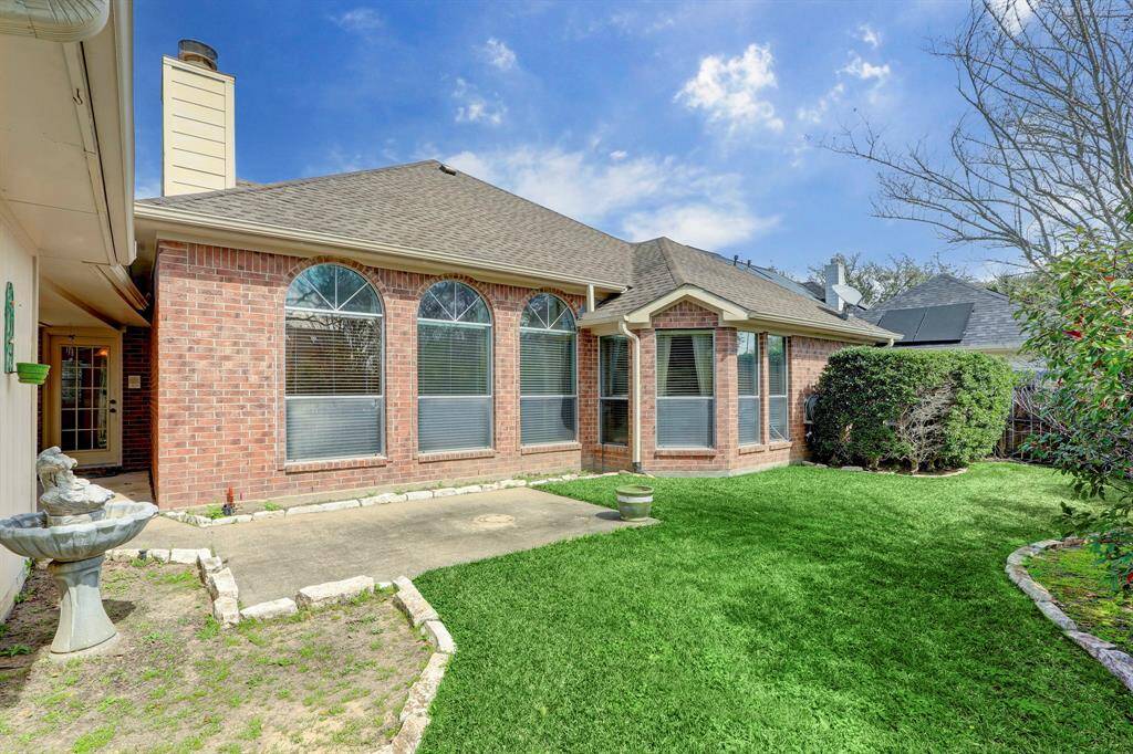 VIEW OF THE BRICK REAR ELEVATION.