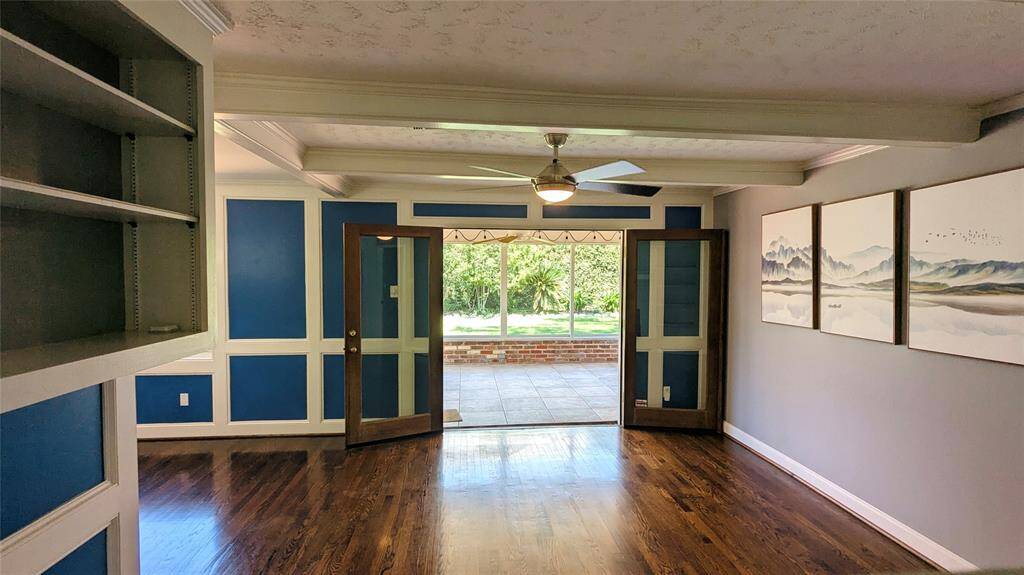 Den looking onto enclosed patio