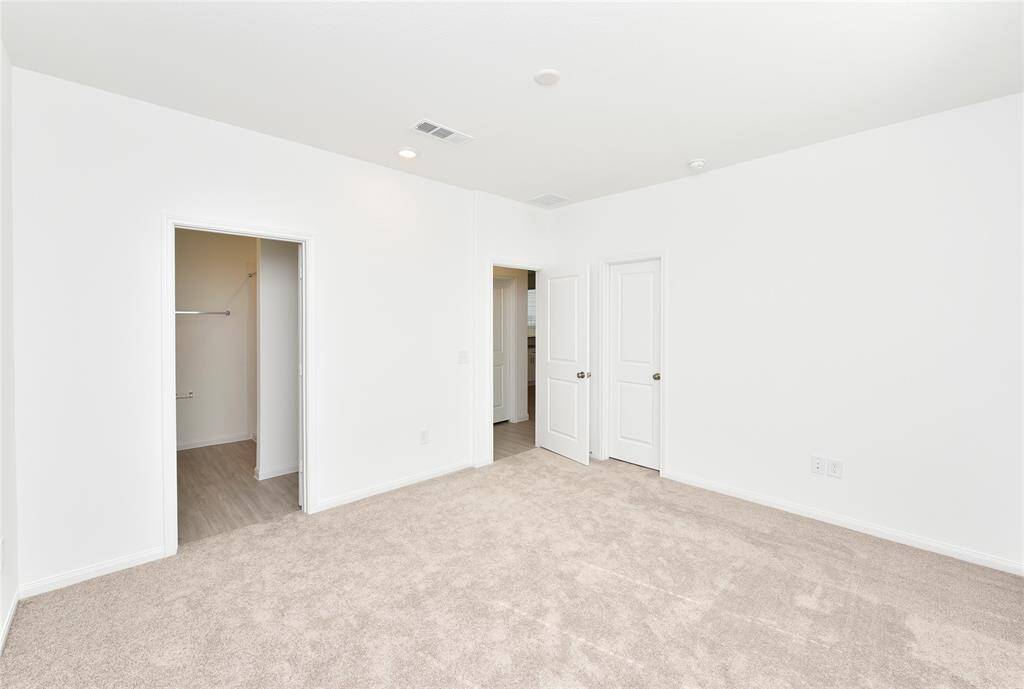 Spacious primary in the back of home for privacy plus en-suite bathroom and walk -in closet.