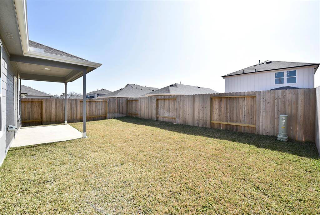 Enjoy the inviting backyard, complete with a covered deck perfect for relaxing outdoors. With plenty of space, it’s ideal for playtime, entertaining, or simply unwinding.