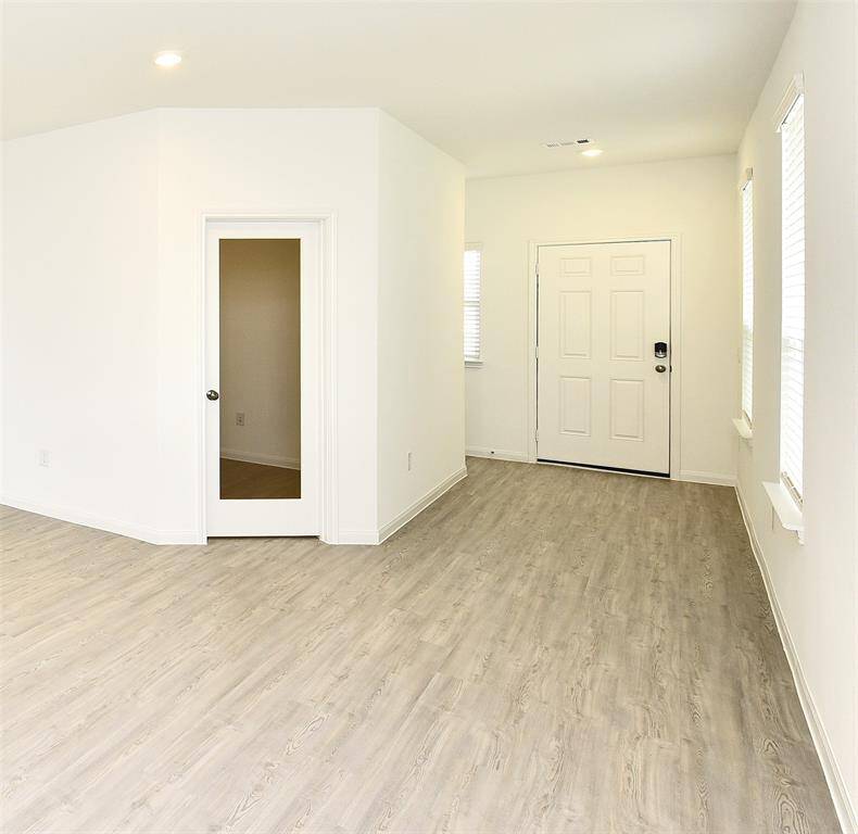 Walk in and take note of the bright and airy feel, high ceilings, beautiful luxury vinyl plank flooring in living areas and 2 inch blinds throughout.