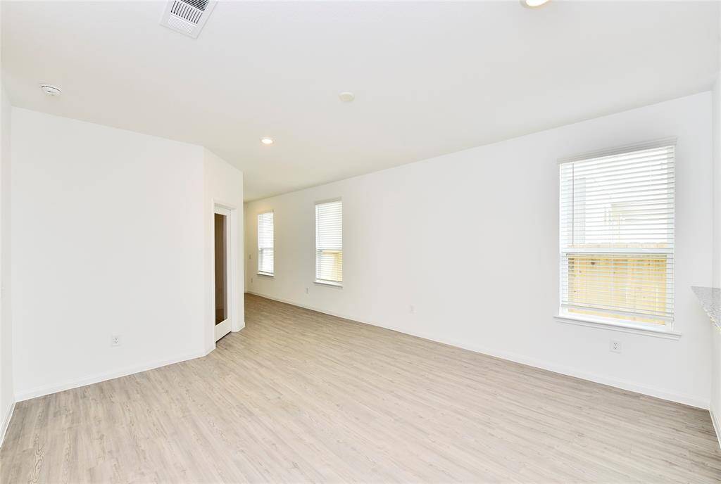 This home features a spacious family room, perfect for relaxing and spending time with family and friends.