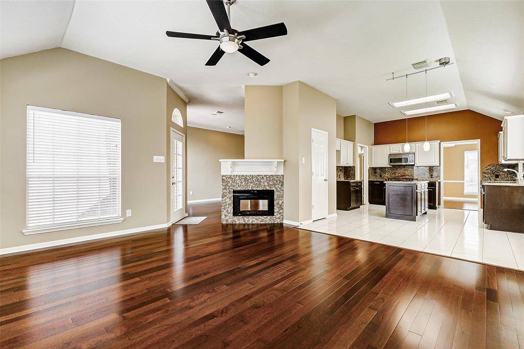 Enjoy effortless transitions between the heart of the home and the comfortable den, conveniently situated just steps from the kitchen.